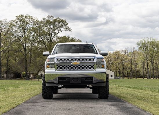 A high-mileage car parked in a park