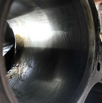 The cross-hatching is still visible on the cylinder wall