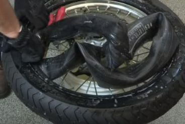 half of a dirt bike tire from the rim