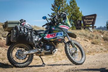 AMSOIL motorcycle parked outside shoshone national forest